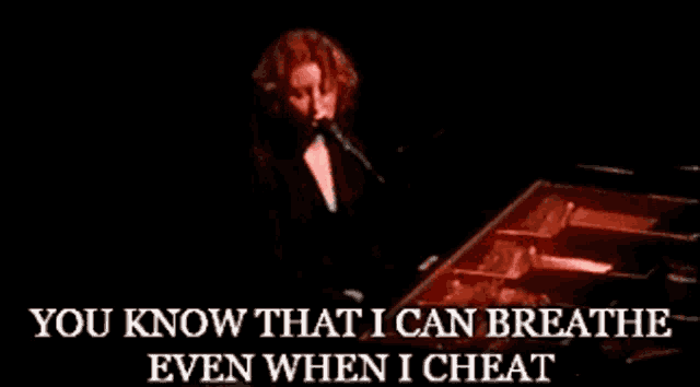 a woman singing into a microphone with the words " you know that i can breathe even when i cheat " below