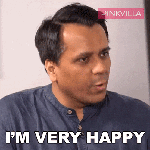 a man says i 'm very happy in front of a pink villa logo