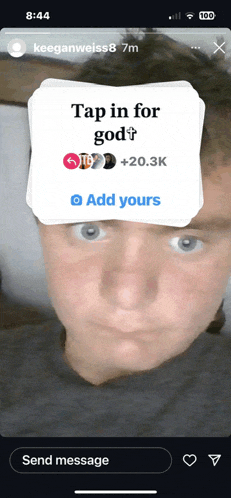 a screenshot of a person 's face with a tap in for god sticker on it