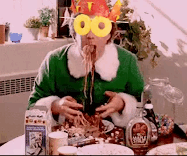 an elf wearing a pineapple hat and sunglasses is eating spaghetti