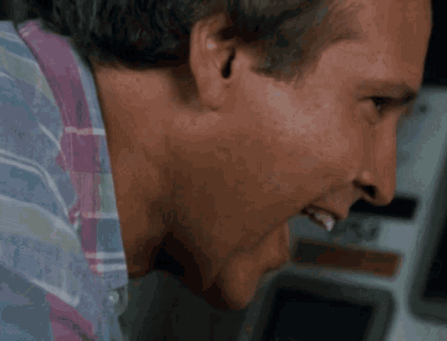 a close up of a man with his mouth open