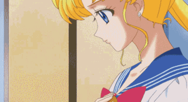 a girl with blonde hair and blue eyes is wearing a school uniform