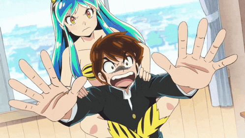 a girl with blue hair is standing next to a boy in a black suit