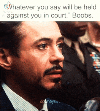 a man in a suit and tie says " whatever you say will be held against you in court boobs "