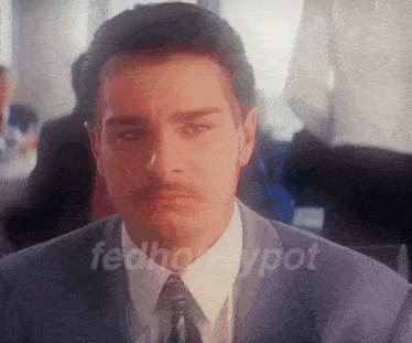 a man in a suit and tie with the words fedhoneypot on the bottom right