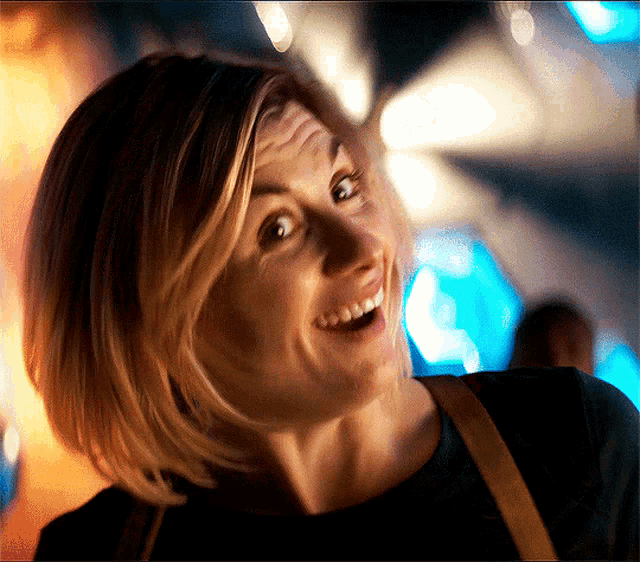 a close up of a woman making a funny face with her mouth open