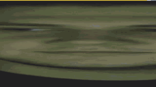 a blurry picture of a person 's face with a smile