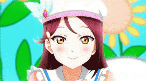 a close up of a girl wearing a white hat and smiling .