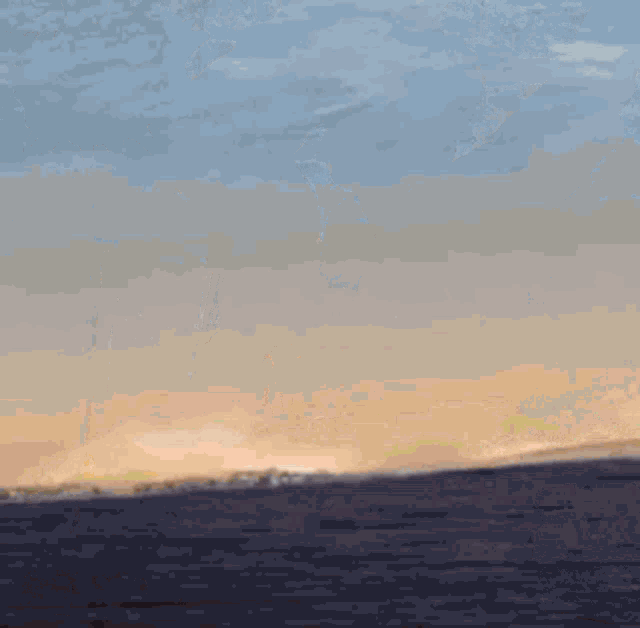a painting of a sunset over a body of water with a yellow pole in the foreground