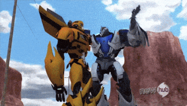 two transformers are standing next to each other with a new hub logo in the background