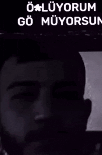 a man with a bandage on his forehead and the words " boluyorum gormüyorsun "