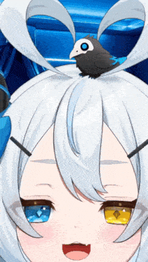 a close up of a girl with a small bird on her head