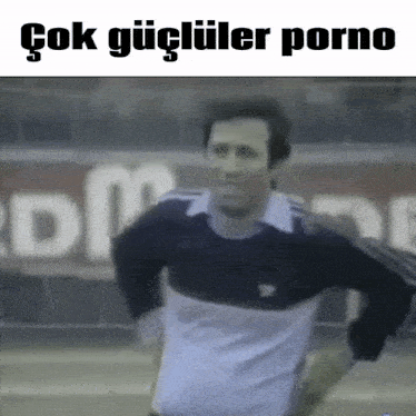 a man in a black and white adidas shirt is running