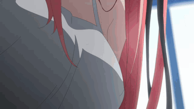 a close up of a woman 's breasts with red hair