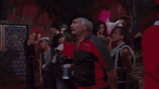 a group of people are dancing in a room with the words hey written on the bottom