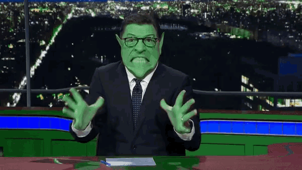 a man in a suit and tie has a green face and glasses