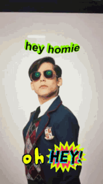 a man in a suit and sunglasses says hey homie oh hey