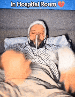 a person in a hospital room with a broken heart