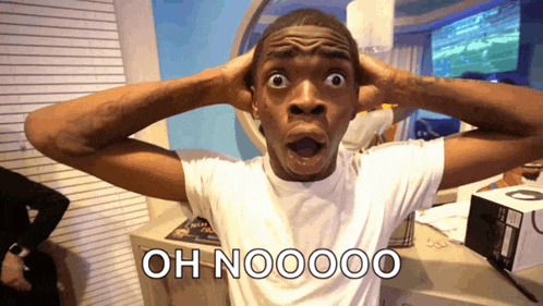 a man with a surprised look on his face holds his hands to his ears and says oh nooooo