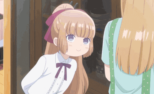 a girl with blonde hair and a purple bow on her head