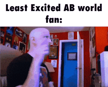 a bald man in a room with the words " least excited ab world fan " below him