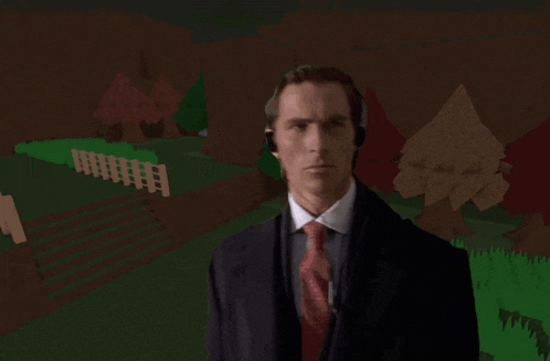 a man in a suit and tie wearing headphones