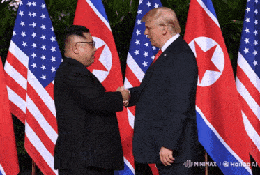 donald trump and kim jong un shake hands in front of flags