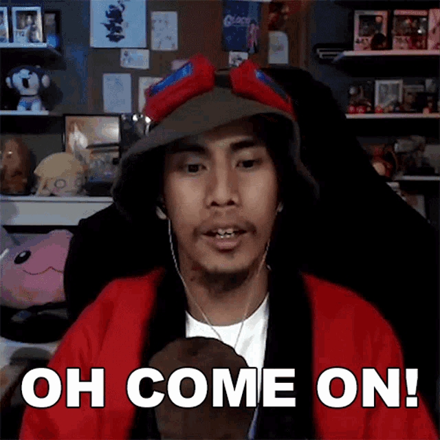 a man wearing a hat and goggles is saying " oh come on "