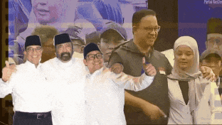 a group of people are posing for a picture and one of them is wearing a hat