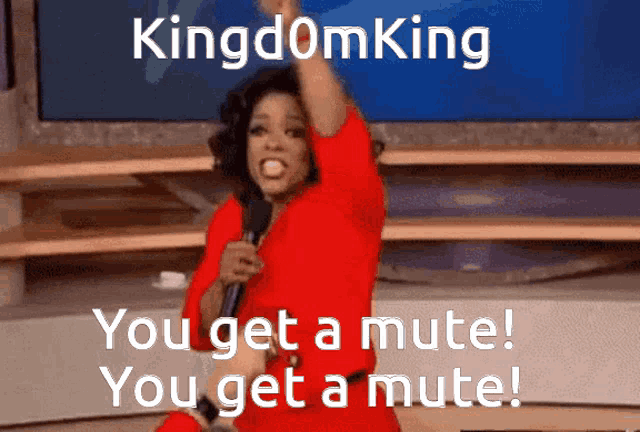 a woman in a red dress is holding a microphone in front of a screen that says kingdomking