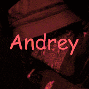 a person with a bandana on their face and the name andrey written in green