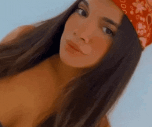 a woman wearing a red bandana on her head