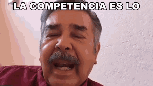 a man with a mustache is making a funny face with the words la competencia es lo below him