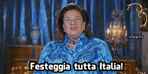 a woman in a blue paisley shirt says festegia tutta italia