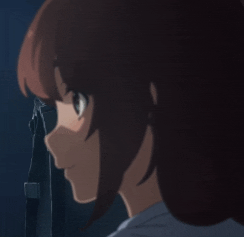 a close up of a girl 's face with a blurred background