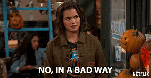 a woman is standing in front of pumpkins and says no in a bad way on netflix