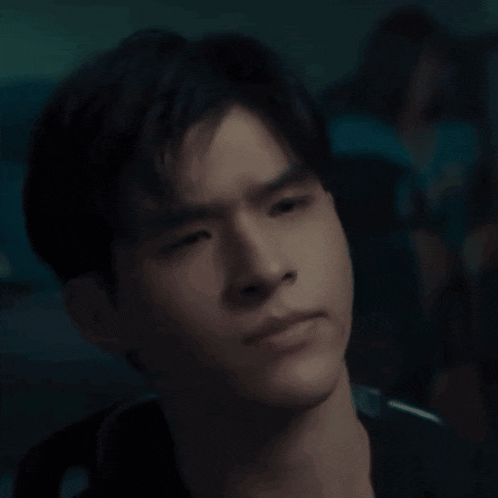 a young man with a serious look on his face