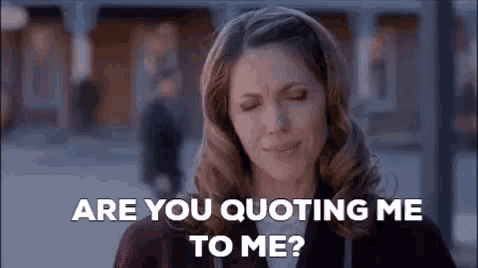 a woman is standing in front of a building with her eyes closed and asking are you quoting me to me ?