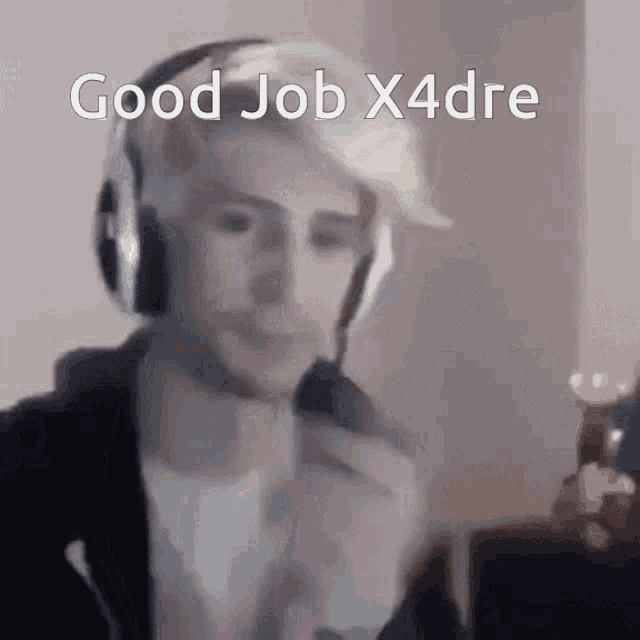 a man wearing headphones and a hat with the words good job x4dre written on it .