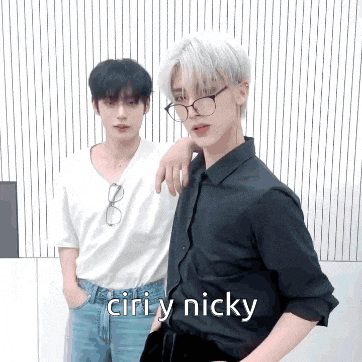 two young men standing next to each other with the words ciri y nicky on the bottom right