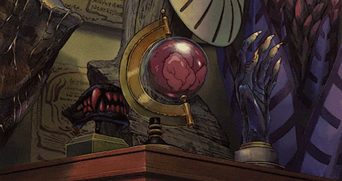 a globe with a blue eye is on a wooden table