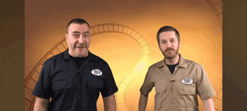 two men are standing next to each other and one of them has a patch on his chest that says ' nbc '