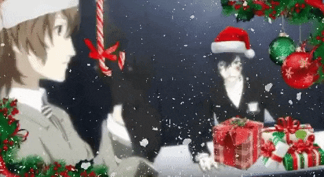 a man wearing a santa hat is standing in front of a christmas tree holding a gift box .