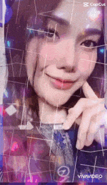 a woman is smiling and making a peace sign in a vivavideo app