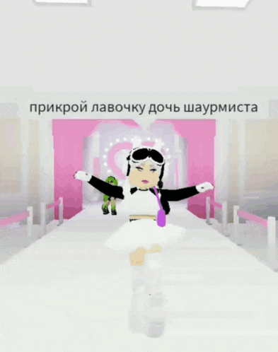 a girl in a white dress is walking down a white carpet in front of a pink curtain