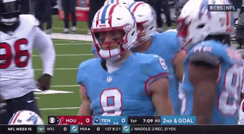 a football player wearing a blue jersey with the number 9 on it