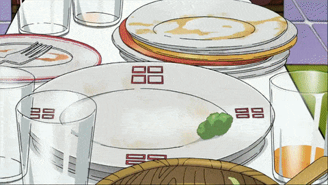 a stack of plates and glasses with a chinese symbol on them