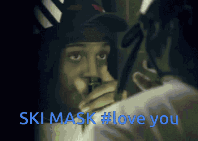 a person wearing a ski mask with the words ski mask #love you below them