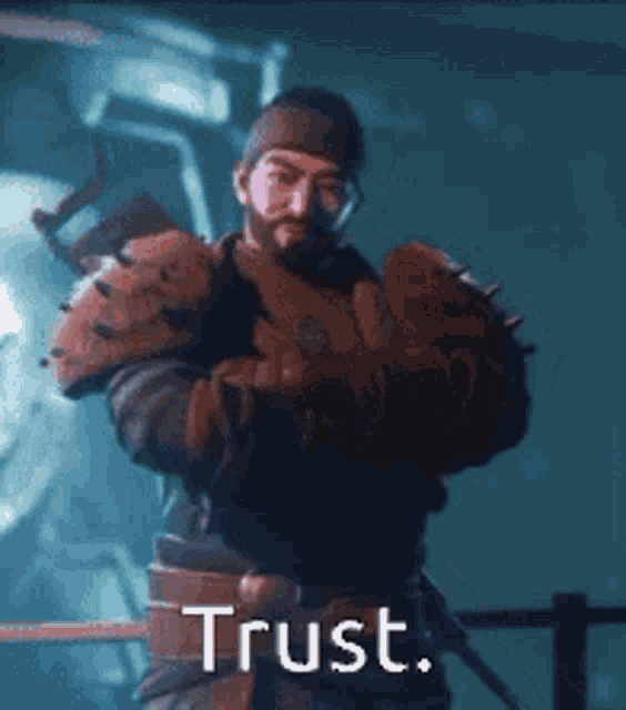a man with a beard is standing in front of a sign that says " trust "