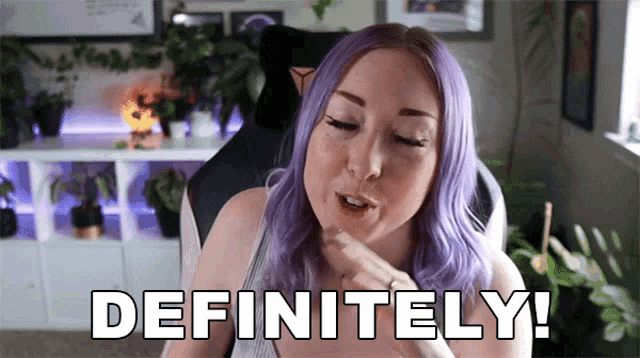 a woman with purple hair is saying definitely